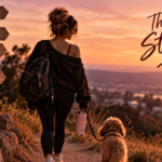 Woman walking a hillside trail with her dog at sunset, leaving old patterns behind and moving toward healing, peace, and higher standards, representing the realization that sometimes an ending is actually the beginning of a better life.