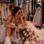Woman sitting exhausted in a bridal shop surrounded by wedding dresses and wilted flowers, representing the absurdity of giving committed, wife-level effort to a relationship offering little commitment, consistency, or investment in return.