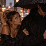 Woman standing in the rain beside a distracted man who is focused on his phone, representing the painful realization that receiving someone's attention is not the same as feeling secure, valued, or emotionally safe.