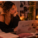Woman reviewing notes on her laptop and reflecting on relationship patterns, reinforcing the idea that consistent actions reveal the truth more clearly than words or promises.