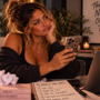The Nerve of Some People Woman sitting at her desk giving her phone an unimpressed side-eye, capturing the disbelief and frustration of dealing with behavior so bold you can only wonder where some people find the nerve.