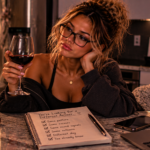 Woman sitting thoughtfully at a kitchen counter, confronting the same patterns, excuses, and mixed signals while realizing she may already know the answer she's trying to change.